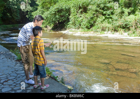 Asian Boy fishing at the river Stock Photo - Alamy