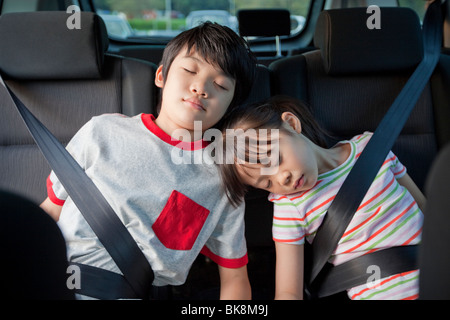 Children Sleeping in a Car Stock Photo