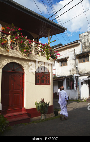 Man walking along street in Galle Fort, Galle, Sri Lanka Stock Photo