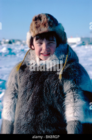 Young Inuit boy in traditional skin clothing. Grise Fjord, Nunavut ...