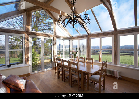An Orangery type conservatory interior of a house with oak frame, Stroud, England,UK. Stock Photo
