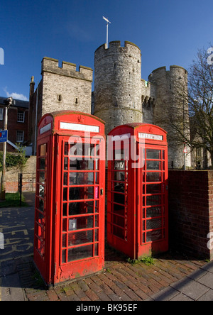 Telephone booths and Westgate towers in Canterbury, Kent, UK. Stock Photo