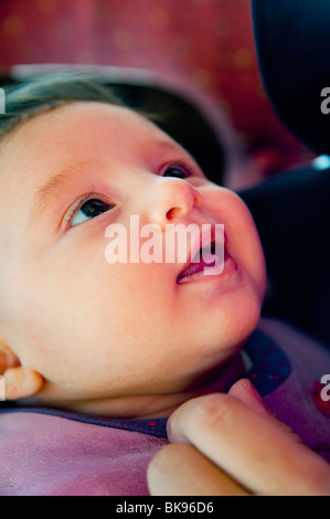 Newborn baby girl looking in wonder Stock Photo