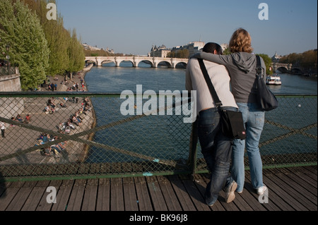 Paris, France, young couple tourists teenager summer, Rear, Lovers, Enjoying Spring Weather on Seine River, VIew from 'Pont des Arts' Bridge, European weekend getaway, looking to  pont neuf, Young adults on holiday Stock Photo