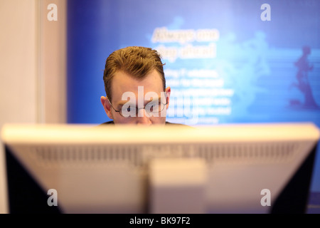 A man working on a computer Stock Photo
