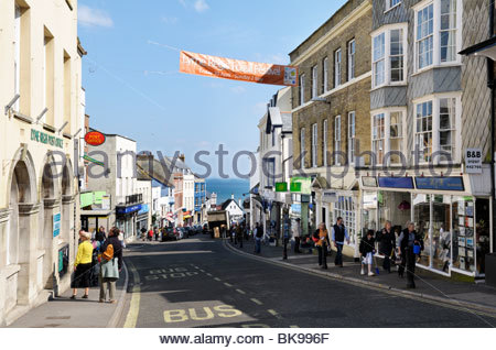 Lyme Regis high street with shops and cars, Dorset, England Stock Photo ...