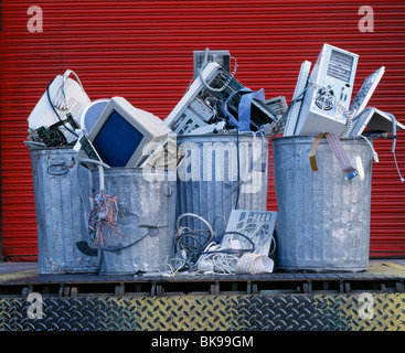 Obsolete computers in garbage cans on a loading dock Stock Photo