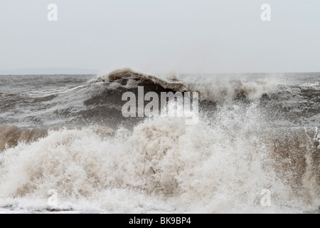 Atlantic breakers on the beach at Porthcawl running alongside the Esplanade Stock Photo