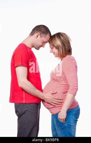 happy expecting couple holding each other - isolated on white Stock Photo