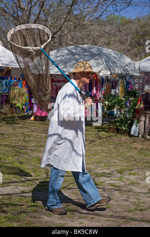 Kanapaha Spring Garden Festival Gainesville Florida man dressed as a butterfly catcher with lab coat hat and large specimen net Stock Photo