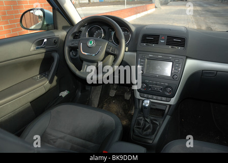 Skoda Yeti 2.0 TDI 4x4 - 2009 - light blue metallic - five doors (5D) - Czech compact SUV - interior (cabin console dashboard) Stock Photo