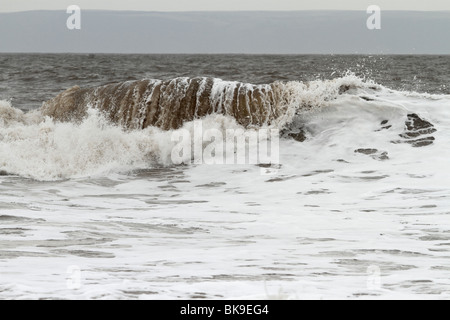 Atlantic breakers on the beach at Porthcawl running alongside the Esplanade Stock Photo