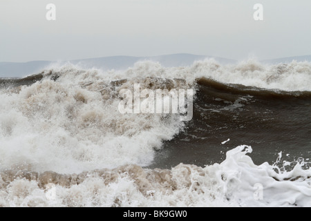 Atlantic breakers on the beach at Porthcawl running alongside the Esplanade Stock Photo