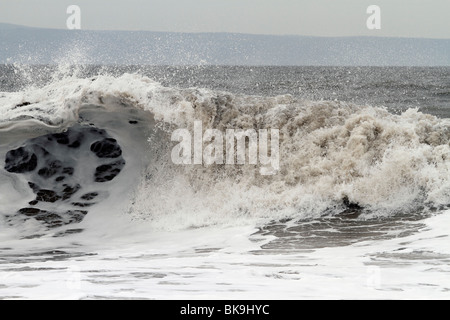 Atlantic breakers on the beach at Porthcawl running alongside the Esplanade Stock Photo