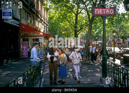 French people person tourists entering Saint-Michel Metro Station Boulevard Saint-Michel Paris Ile-de-France region France Stock Photo