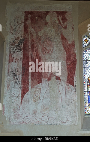 Medieval wall painting depicting Saint Christopher carrying the Infant Jesus across the stream Stock Photo