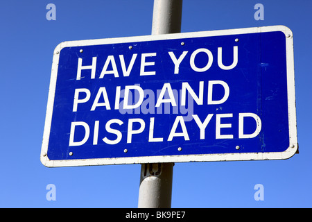 Sign at a car park asking 'Have you paid and Displayed' referring to the purchase and displaying of a car parking ticket Stock Photo