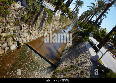 Main water canal running through the town of Kusadasi in Turkey on the Aegean coast Stock Photo