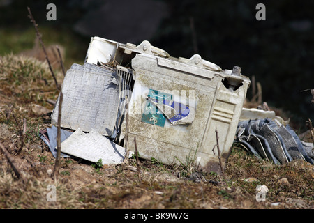 Closeup of an Automotive Car Lead Acid Battery Dumped in the Countryside which has Split Exposing the Lead Plates. Stock Photo