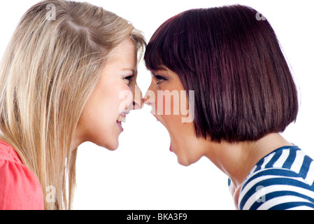 two teenage girls shouting at each other Stock Photo