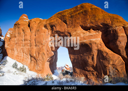 Pine Tree Arch is one of a number of arches on the beautiful Devil's Garden Trail in Arches National Park, Utah. Stock Photo
