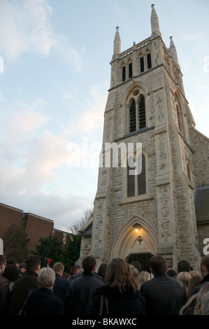 Polish people mourn outside St. Andrew Bobola Roman Catholic Church for victims of plane crash funeral mass, London, Britain, UK Stock Photo