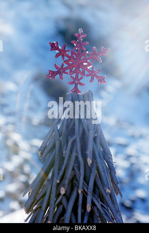 Christmas red star in a snow day. Xtmas card Stock Photo