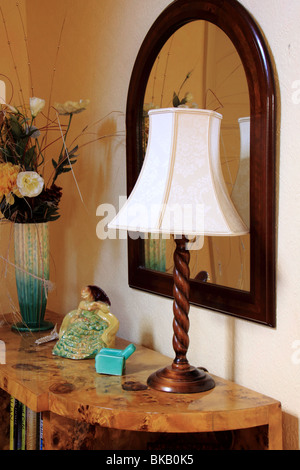 Art Deco bookcase with mirror and lamp Stock Photo