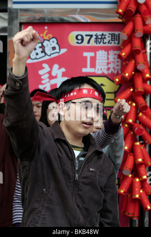 School boy yells slogan with classmates for studying hard in order pass college examination. Stock Photo