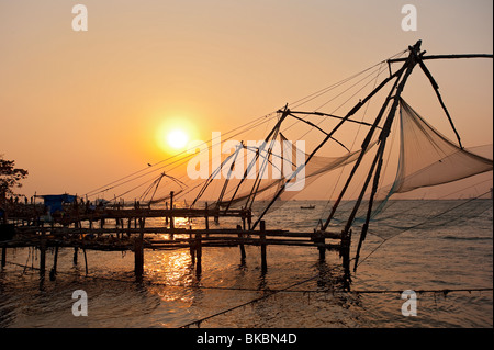 Chinese Fishing nets at sunset, Fort Cochin, Kerala, India Stock Photo