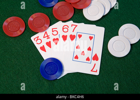 A 'straight flush' poker hand, of hearts, in five card draw or stud poker Stock Photo