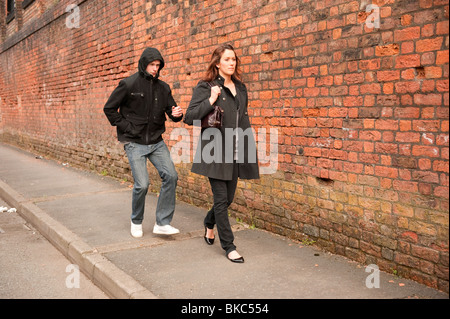 Male stalking lone female to steal handbag. Posed by Models. FULLY ...