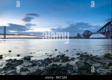 The Forth Road and Rail Bridges at twilight, as viewed from the Edinburgh side, South Queensferry. Stock Photo