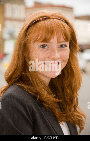portrait of a teenage girl with red hair blue eyes and lots of freckles Stock Photo