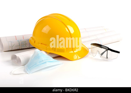 Hard hat, plans and safety protection equipment in the construction industry Stock Photo