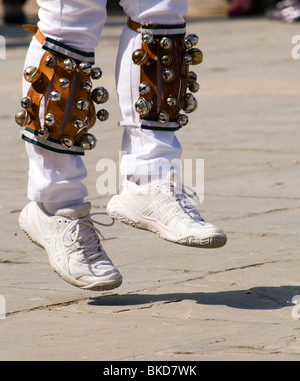 Detail of Morris dancers' legs in action with bells on Stock Photo