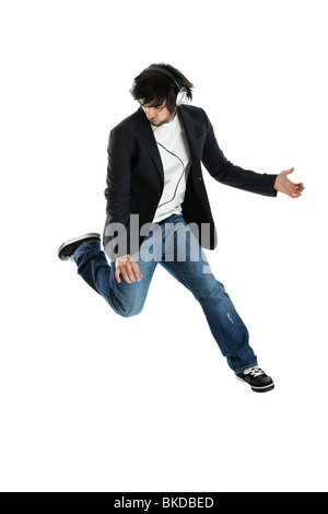 Young modern man jumping over a white background Stock Photo