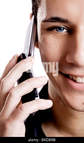 Happy young guy talking on cellphone isolated on white background Stock Photo