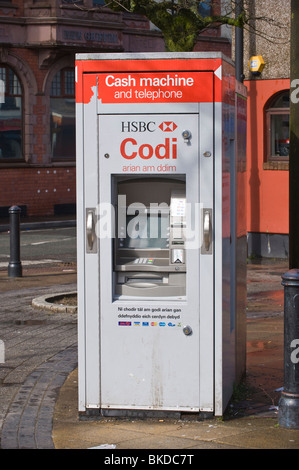 HSBC Cash Machine and telephone bilingual Welsh English language in South Wales Valleys town of Brynmawr Stock Photo