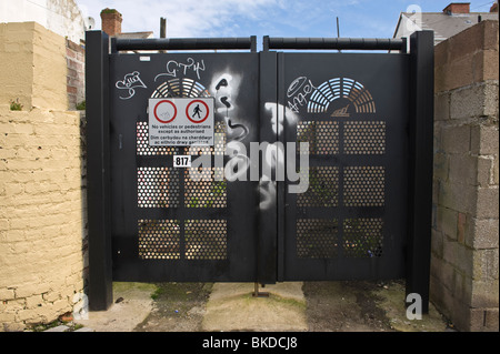 Security gates crime prevention measure at entrance to back lane between houses in Barry Vale of Glamorgan South Wales UK Stock Photo