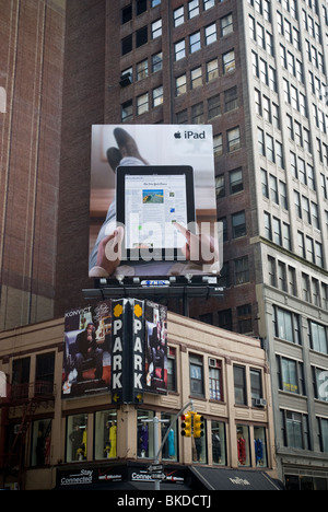 Advertising for the Apple Inc. iPad on a billboard in Midtown Manhattan in New York Stock Photo