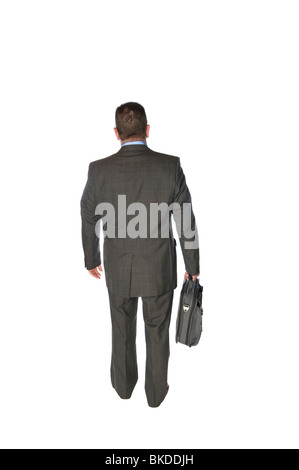 A businessman isolated on white walks away in a rear view fashion carrying his briefcase. Stock Photo