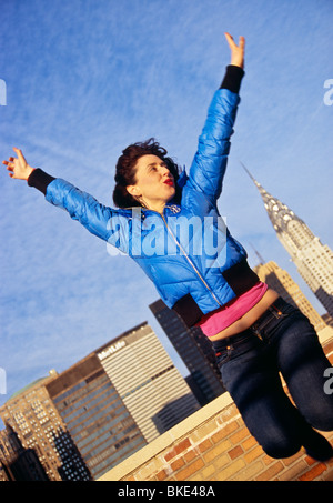 'Young Woman Jumping for Joy ' Stock Photo