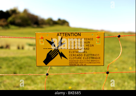 Electric Fence warning sign to keep animals away Stock Photo