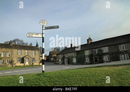 An old fashioned signpost at the village of Burnsall, Upper Wharfedale, in the Yorkshire Dales, England, UK Stock Photo