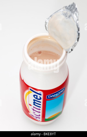 Single open plastic container of Actimel strawberry flavoured drink Stock Photo