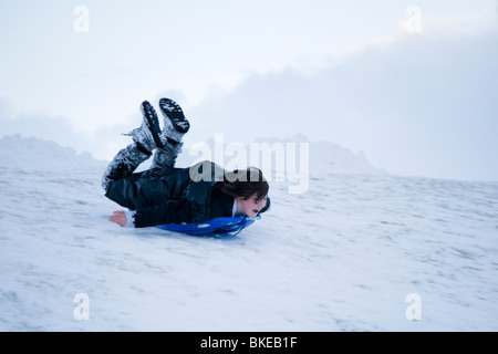 One boy playing in the snow. Hafnarfjordur, Greater Reykjavik Area, Iceland Stock Photo