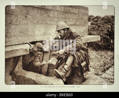 WWI soldier receiving letter from the postman / mail carrier in trench in West Flanders during First World War One, Belgium