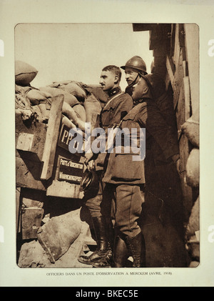 WWI officers in trench at observation post watching the battlefield at Merkem, West Flanders during First World War One, Belgium Stock Photo