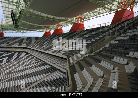 Interior of the Mbombela stadium In Nelspruit  showing the zebra-striped seating and stadium roof Stock Photo